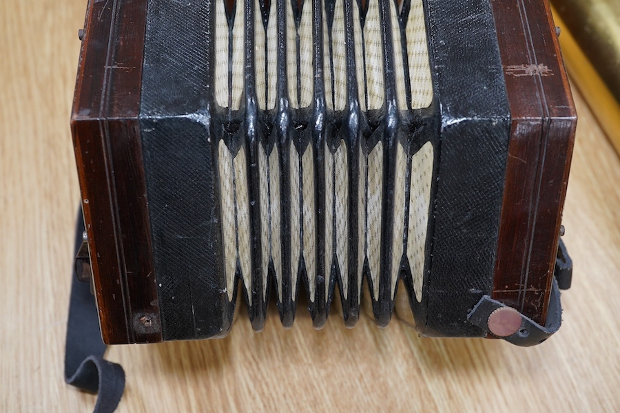 A mid-19th century Lachenal & Co., London mahogany concertina, in an hexagonal mahogany case. Condition - fair to good, the leatherwork on the bellows appears sound and strong.